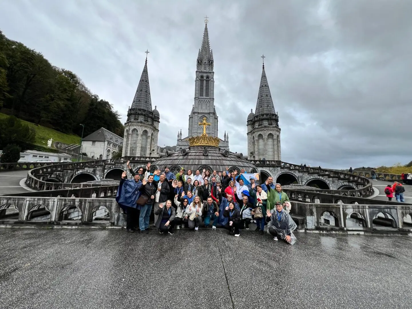 A group of people standing in front of a church.