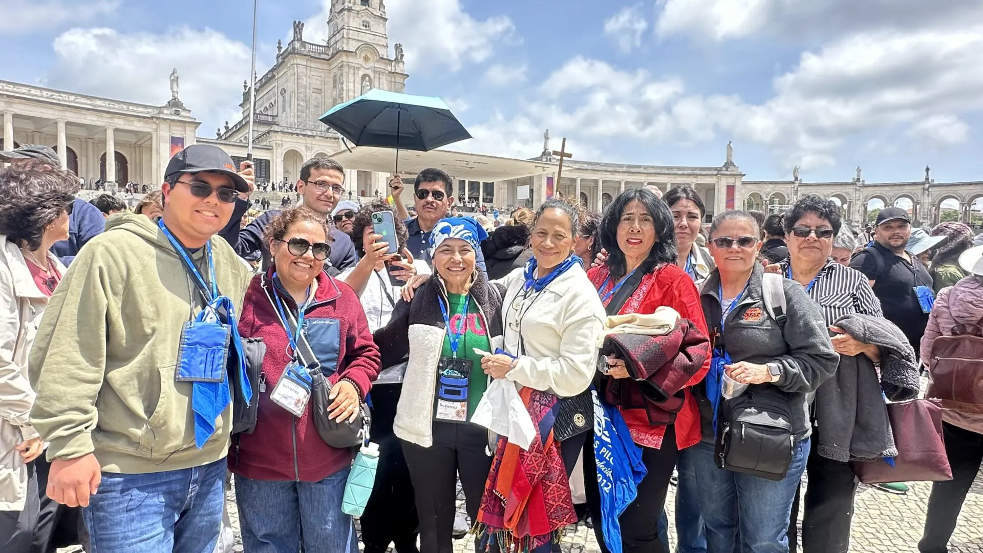 A group of people standing in front of a building.